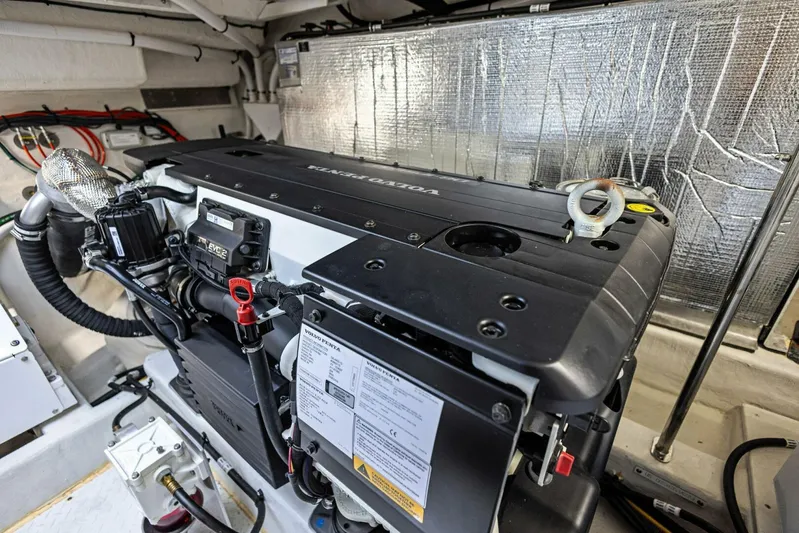 Bradventures Yacht Photos Pics Engine room of 2023 Cruisers Yachts 42 Cantius, showcasing modern marine engine components.