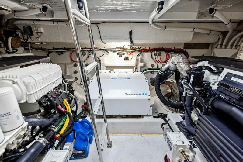 Bradventures Yacht Photos Pics Engine room of 2023 Cruisers Yachts 42 Cantius, showcasing mechanical components and wiring.