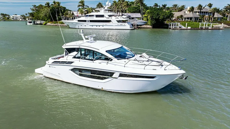 Bradventures Yacht Photos Pics 2023 Cruisers Yachts 42 Cantius in a scenic marina setting.