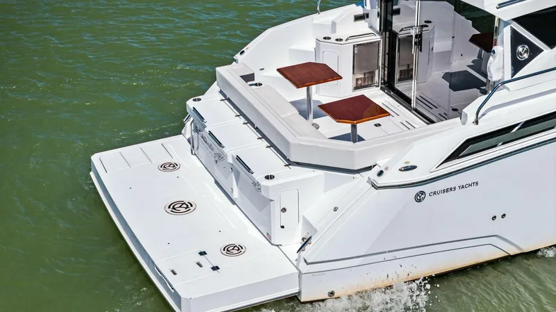 Bradventures Yacht Photos Pics 2023 Cruisers Yachts 42 Cantius, rear view, featuring spacious deck and modern design.