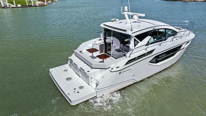 Bradventures Yacht Photos Pics 2023 Cruisers Yachts 42 Cantius on calm water, showcasing sleek design and modern features.