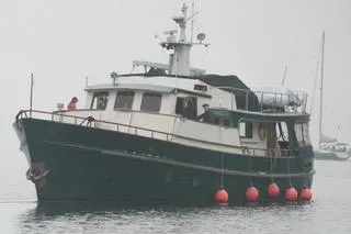 Orina Yacht Photos Pics 1971 Southern Marine MALAHIDE Pilothouse LRC boat on calm water with red buoys.