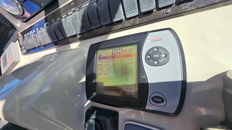  Yacht Photos Pics Control panel of a 2005 Sea Ray 390 Sundancer boat with navigation display.