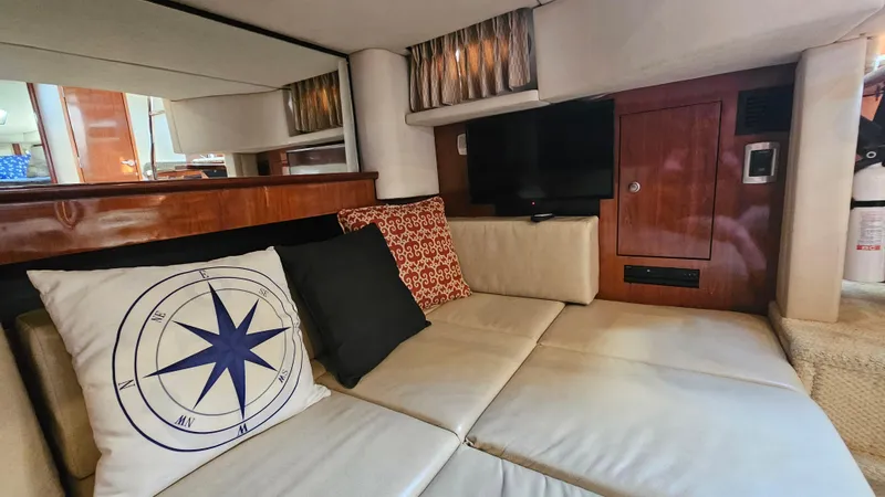  Yacht Photos Pics Interior of 2005 Sea Ray 390 Sundancer with cozy seating and decorative pillows.