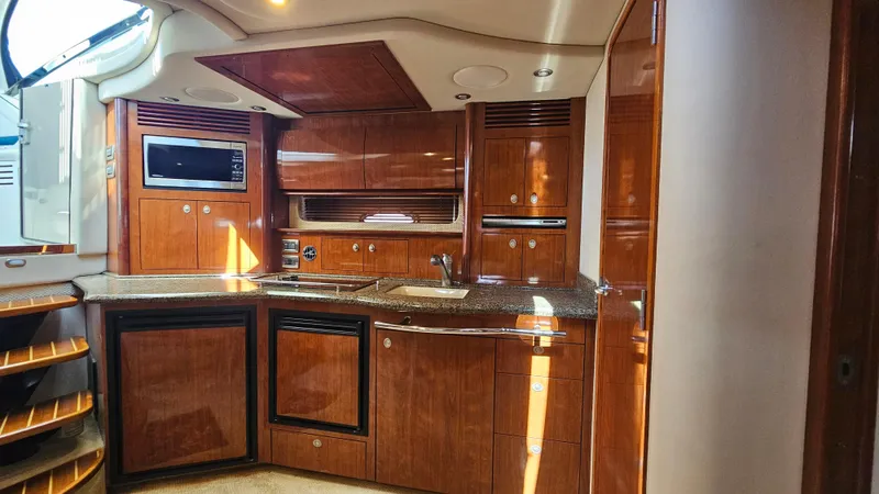  Yacht Photos Pics Luxurious 2005 Sea Ray 390 Sundancer yacht interior with modern kitchen amenities.