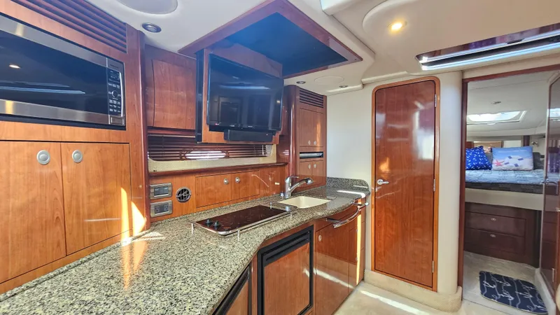  Yacht Photos Pics Luxurious 2005 Sea Ray 390 Sundancer yacht interior with modern kitchen amenities.