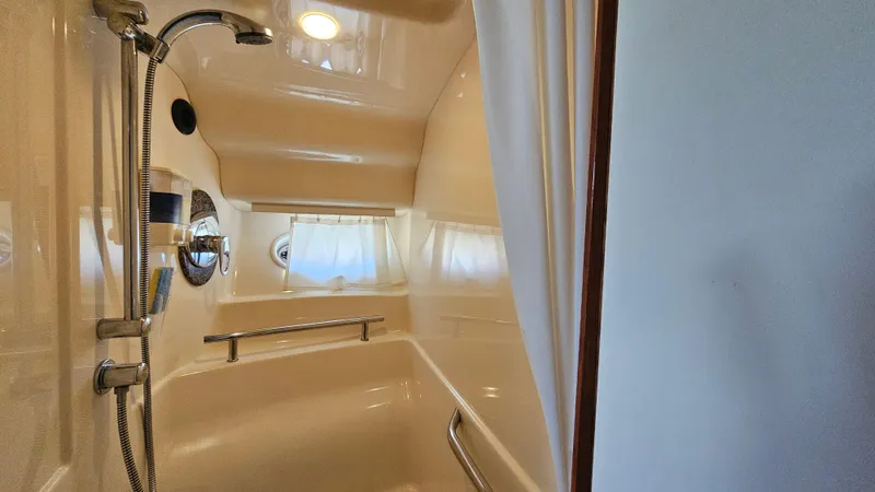  Yacht Photos Pics Shower area in 2005 Sea Ray 390 Sundancer yacht, featuring sleek design and modern fixtures.