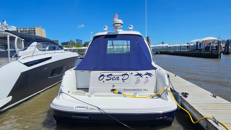  Yacht Photos Pics 2005 Sea Ray 390 Sundancer docked in Edgewater, NJ, under clear blue skies.