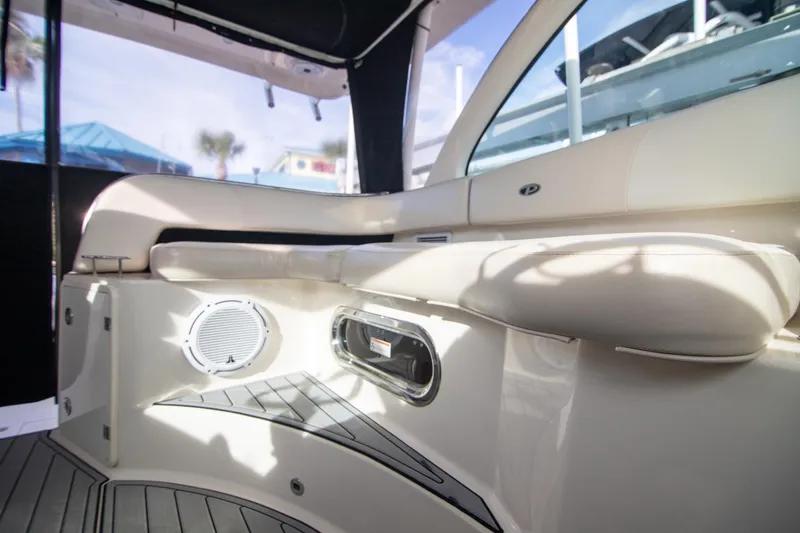 Let&rsquo;s Go II Yacht Photos Pics Interior of 2013 Pursuit OS 345 Offshore boat with cushioned seating and speaker.