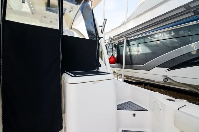 Let&rsquo;s Go II Yacht Photos Pics 2013 Pursuit OS 345 Offshore boat interior with black and white design elements.