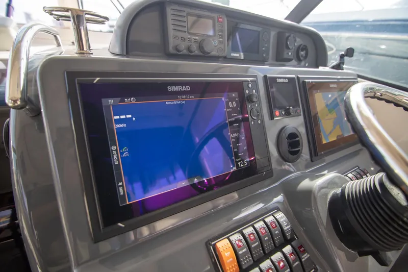 Let&rsquo;s Go II Yacht Photos Pics 2013 Pursuit OS 345 Offshore boat dashboard with Simrad navigation system.