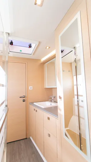 Just The Tip Yacht Photos Pics Modern bathroom interior of 2020 Fountaine Pajot MY 40 yacht, featuring sleek design and ample lighting.