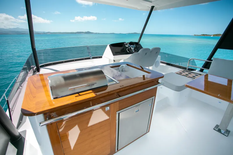 Just The Tip Yacht Photos Pics Flybridge of 2020 Fountaine Pajot MY 40 yacht with ocean view and outdoor kitchen.