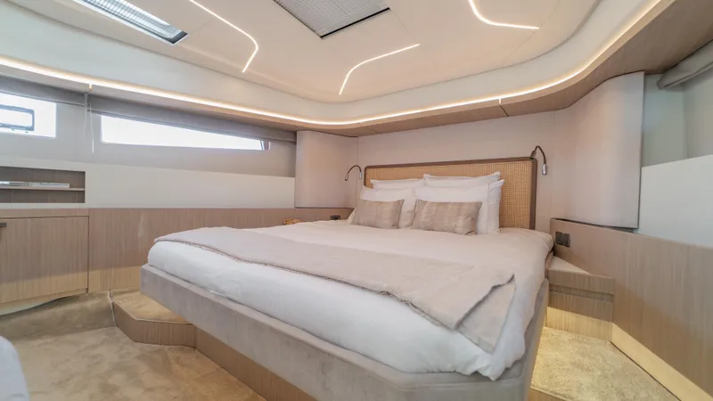  Yacht Photos Pics Luxurious bedroom interior of 2025 Prestige F4.9 yacht with modern design and ambient lighting.