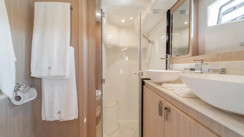  Yacht Photos Pics Luxurious bathroom in 2025 Prestige F4.9 yacht with modern fixtures and elegant design.