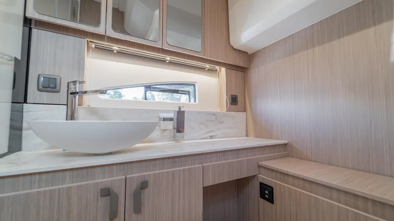  Yacht Photos Pics Modern bathroom interior in Prestige F4.9, 2026 model, featuring sleek design and elegant fixtures.
