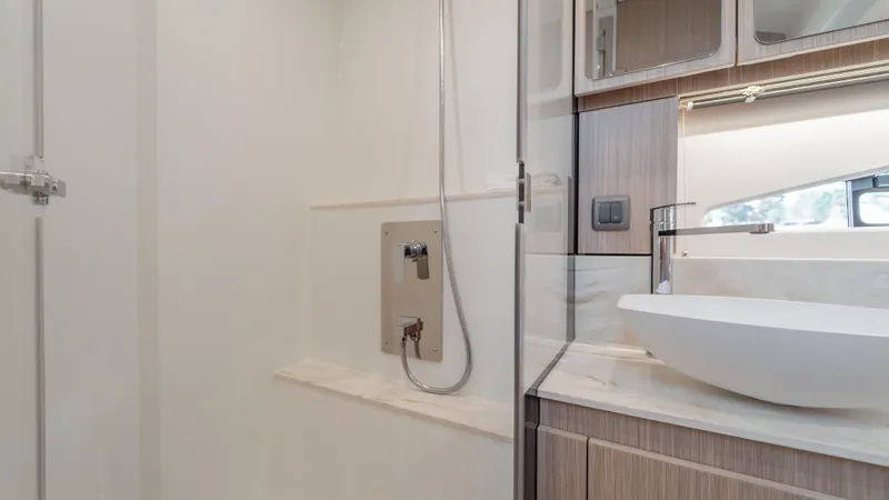  Yacht Photos Pics Modern bathroom interior in 2026 Prestige F4.9 yacht, featuring sleek fixtures and elegant design.