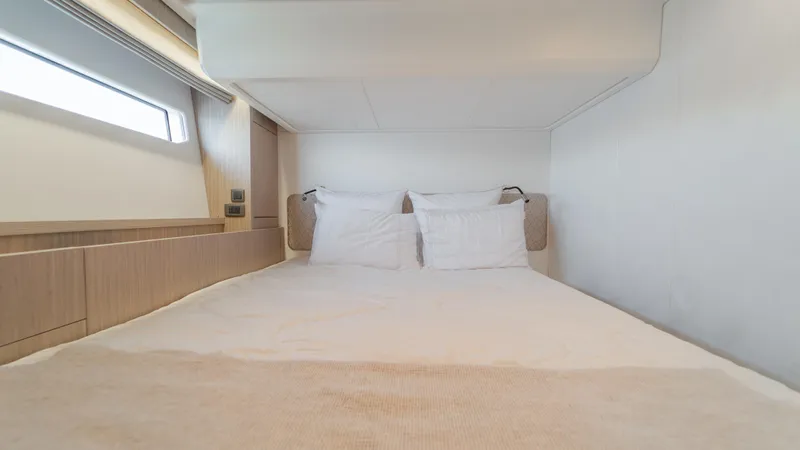  Yacht Photos Pics Luxurious cabin interior of 2025 Prestige F4.9 yacht with cozy bedding.