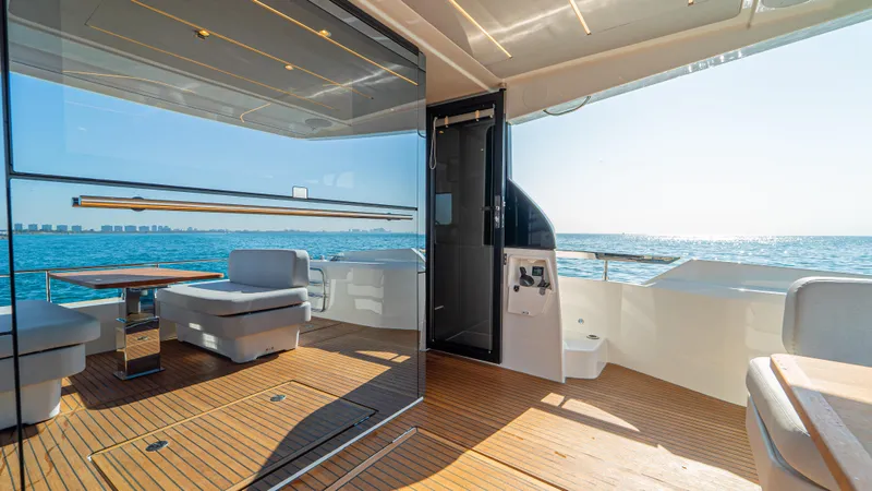  Yacht Photos Pics Luxurious 2025 Prestige F4.9 yacht interior with ocean view and modern seating.