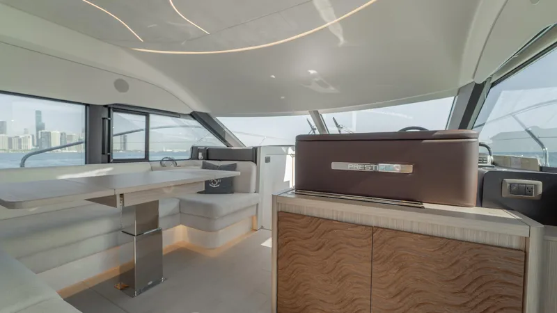  Yacht Photos Pics Luxurious interior of 2025 Prestige F4.9 yacht with modern design and city skyline view.