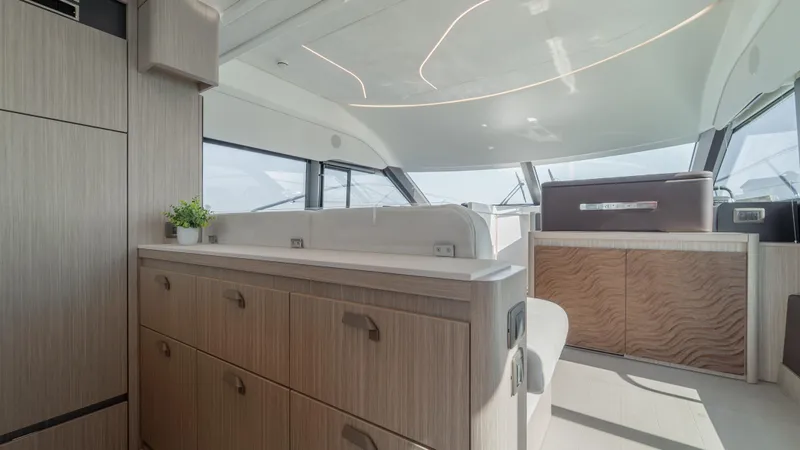 Yacht Photos Pics Luxurious interior of 2025 Prestige F4.9 yacht with modern cabinetry and sleek design.