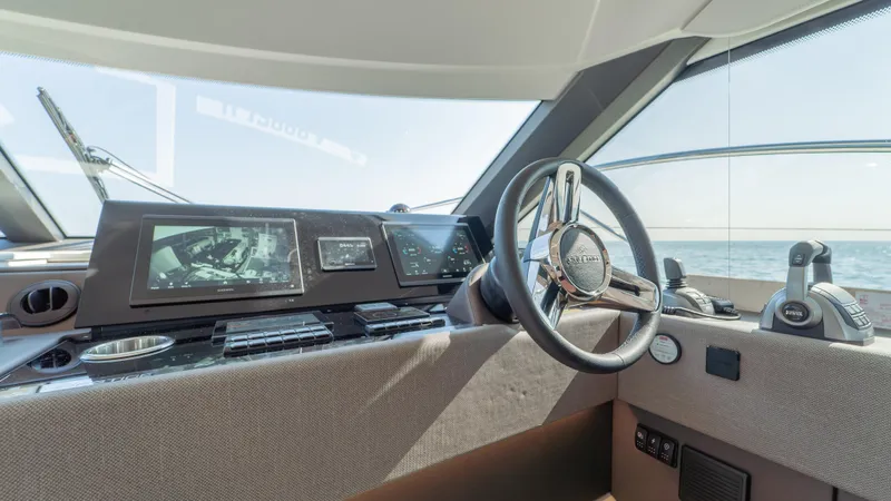  Yacht Photos Pics Interior view of 2025 Prestige F4.9 yacht cockpit with modern navigation controls.