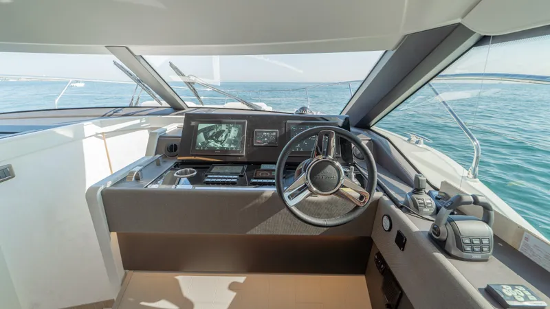  Yacht Photos Pics Helm of 2025 Prestige F4.9 yacht with modern controls and ocean view.
