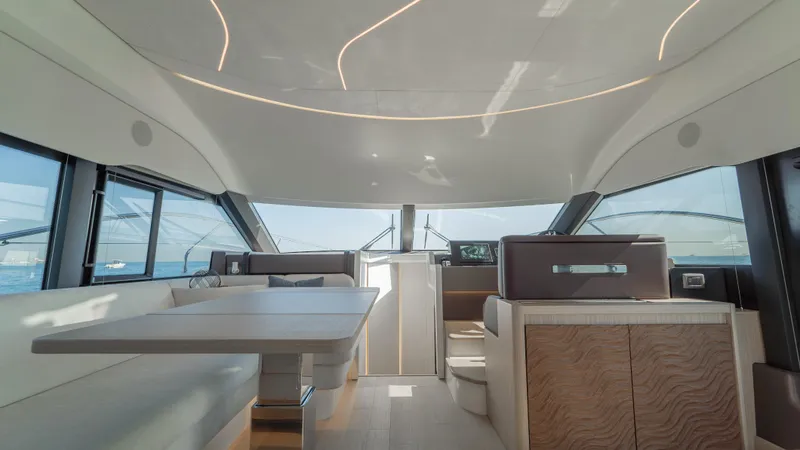  Yacht Photos Pics Luxurious interior of 2025 Prestige F4.9 yacht with modern seating and panoramic windows.