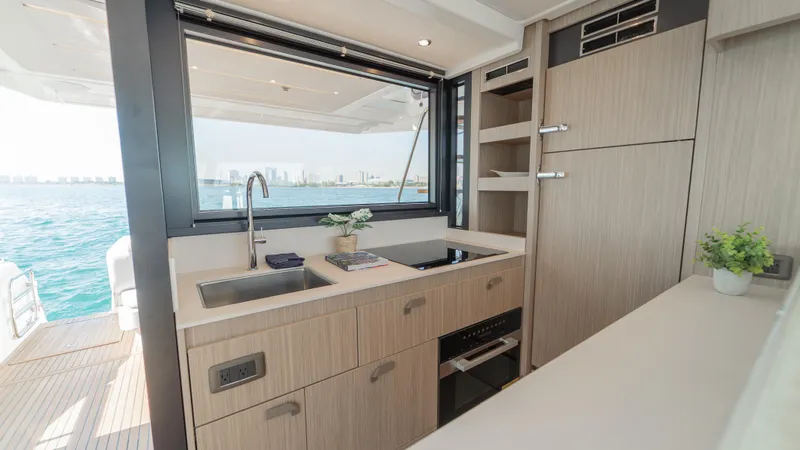  Yacht Photos Pics Modern kitchen interior on 2025 Prestige F4.9 yacht with ocean view.