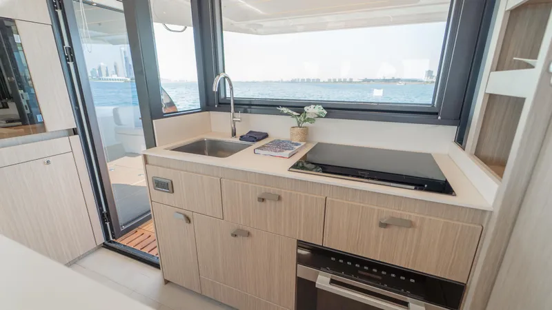  Yacht Photos Pics Modern kitchen on Prestige F4.9 yacht, featuring sleek design and ocean view, 2025 model.