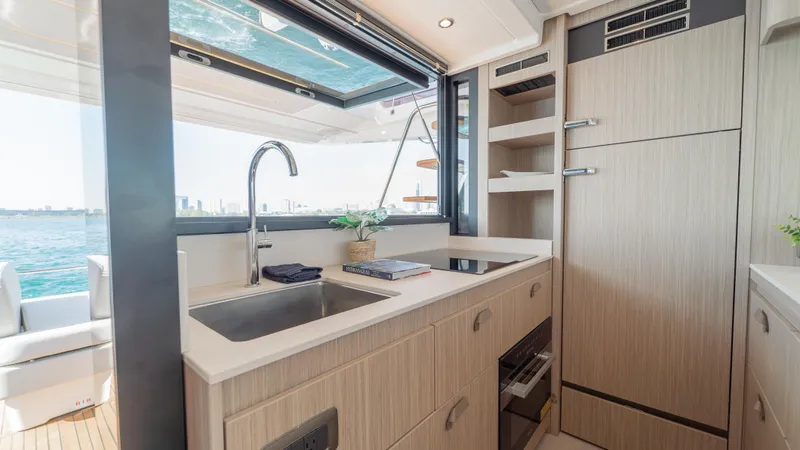  Yacht Photos Pics Modern kitchen interior on 2025 Prestige F4.9 yacht with ocean view.