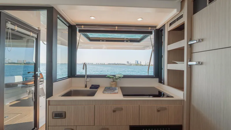  Yacht Photos Pics Modern kitchen interior on Prestige F4.9 yacht, 2025 model, with ocean view.