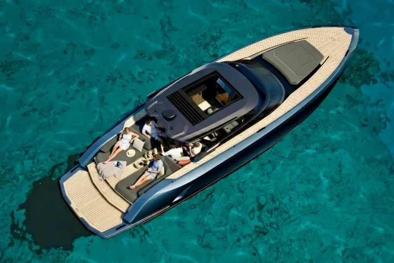  Yacht Photos Pics Luxurious 2026 Flynt Yachts Revolante 48 cruising on clear turquoise waters.