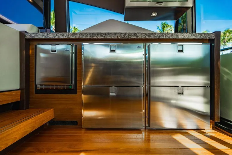 Happy Daze IV Yacht Photos Pics Luxurious kitchen area in 2017 Tiara Yachts 53 Coupe with stainless steel appliances.