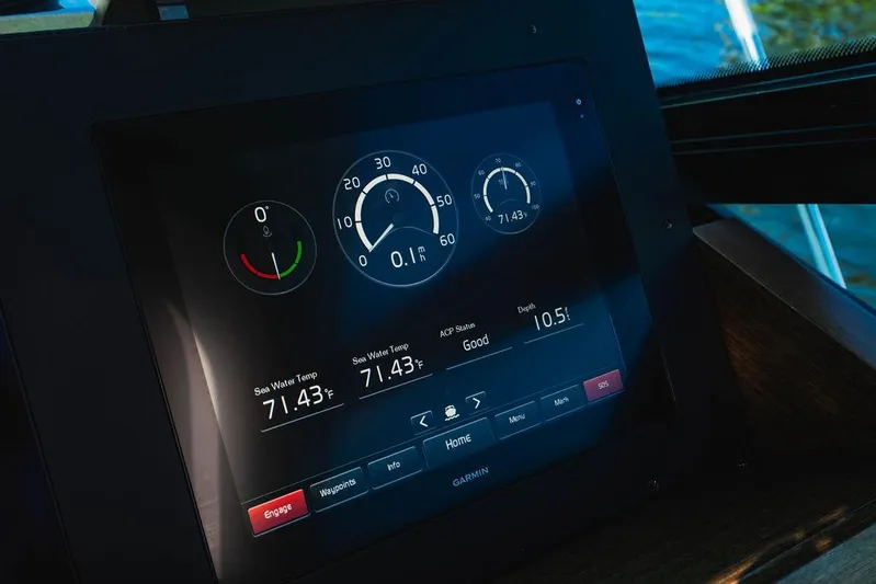 Happy Daze IV Yacht Photos Pics Dashboard display of a 2017 Tiara Yachts 53 Coupe, showing engine metrics and navigation data.