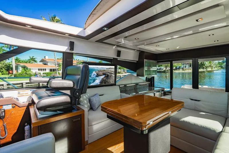 Happy Daze IV Yacht Photos Pics Luxurious interior of 2017 Tiara Yachts 53 Coupe with scenic waterfront view.
