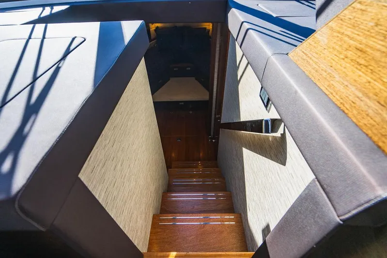 Happy Daze IV Yacht Photos Pics Staircase leading to cabin interior of 2017 Tiara Yachts 53 Coupe.