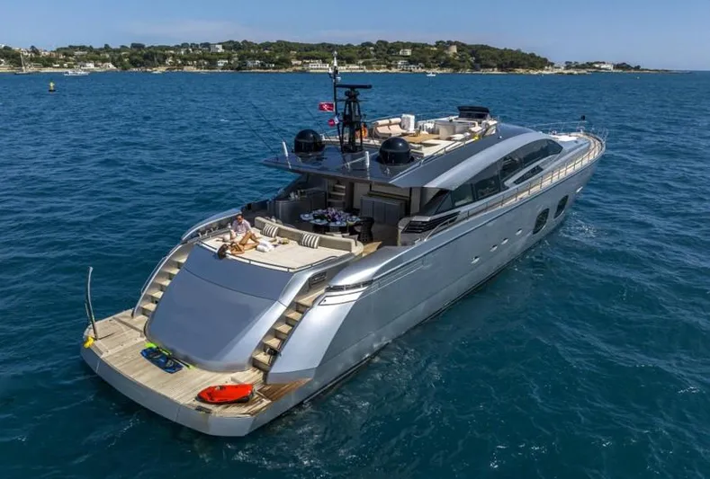  Yacht Photos Pics Luxurious 2013 Pershing 108 yacht cruising on blue ocean waters.
