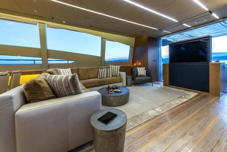  Yacht Photos Pics Luxurious interior of 2013 Pershing 108 yacht with modern seating and panoramic windows.