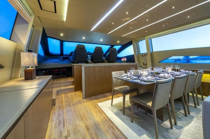  Yacht Photos Pics Luxurious interior of 2013 Pershing 108 yacht with elegant dining area and modern helm.