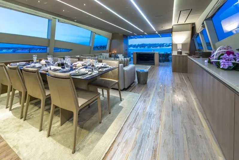 Yacht Photos Pics Luxurious interior of 2013 Pershing 108 yacht with elegant dining area and panoramic windows.