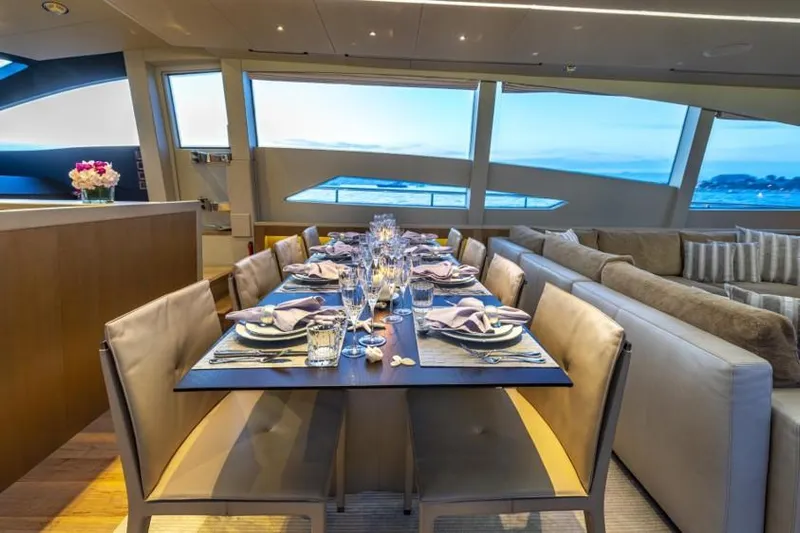  Yacht Photos Pics Luxurious dining area on a 2013 Pershing 108 yacht with ocean view.