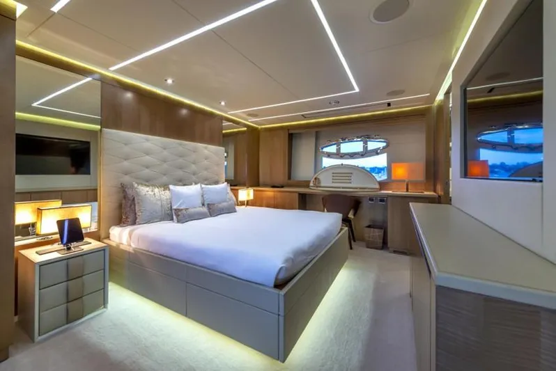  Yacht Photos Pics Luxurious bedroom interior on 2013 Pershing 108 yacht, featuring modern design and ambient lighting.