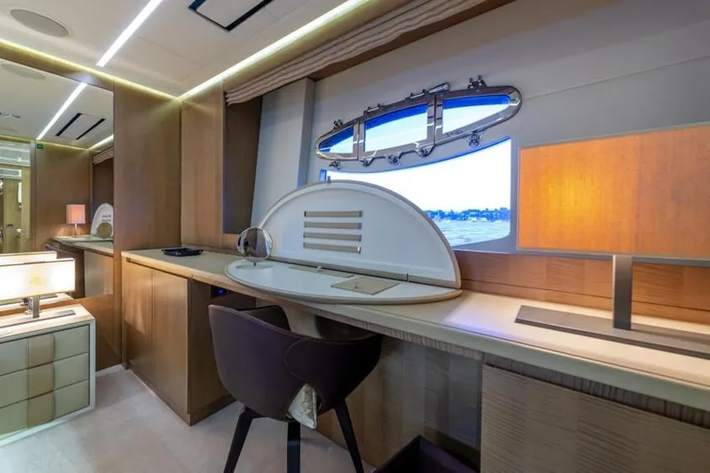  Yacht Photos Pics Luxurious interior of 2013 Pershing 108 yacht with elegant desk and window view.
