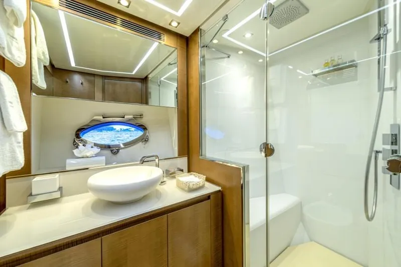  Yacht Photos Pics Luxurious bathroom on a 2013 Pershing 108 yacht with modern fixtures and elegant design.