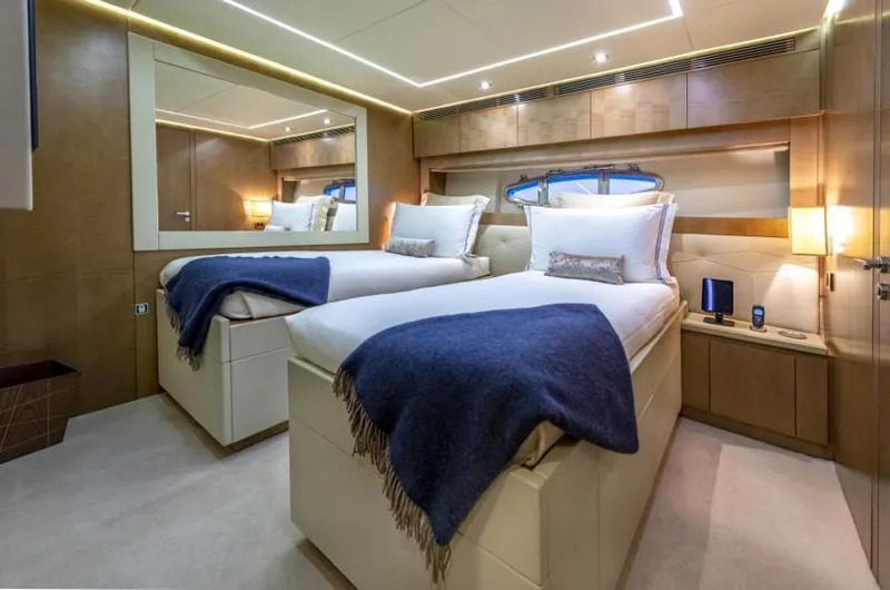  Yacht Photos Pics Luxurious twin bedroom on 2013 Pershing 108 yacht with elegant decor and cozy bedding.