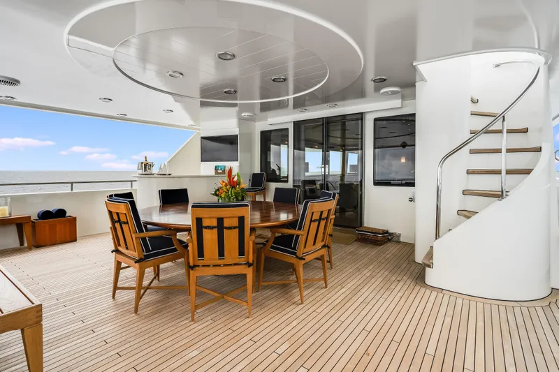 Avalina Yacht Photos Pics Luxurious 2003 Westport yacht deck with elegant dining area and spiral staircase.