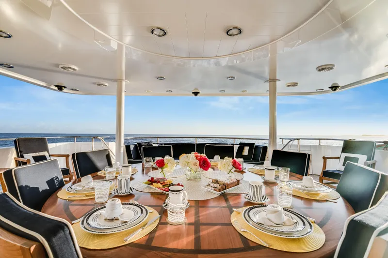 Avalina Yacht Photos Pics Luxurious dining setup on 2003 Westport yacht with ocean view and elegant tableware.