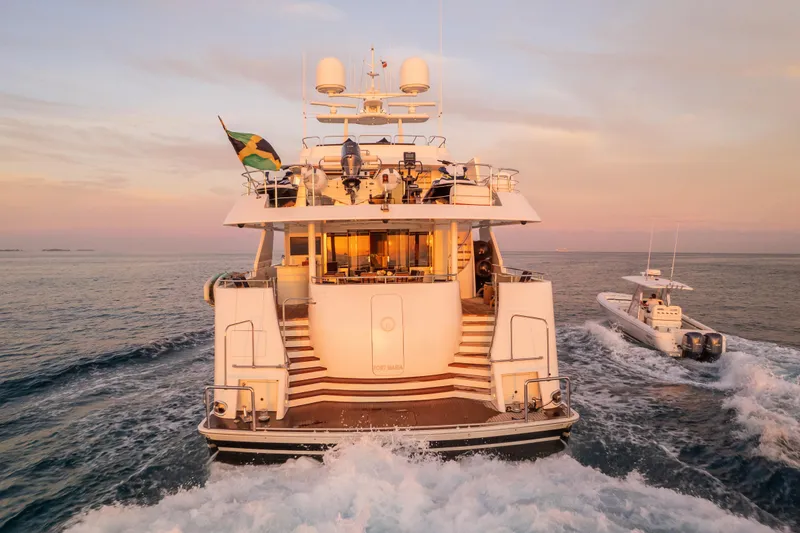 Avalina Yacht Photos Pics Luxury Westport 2003 yacht cruising at sunset with accompanying speedboat.