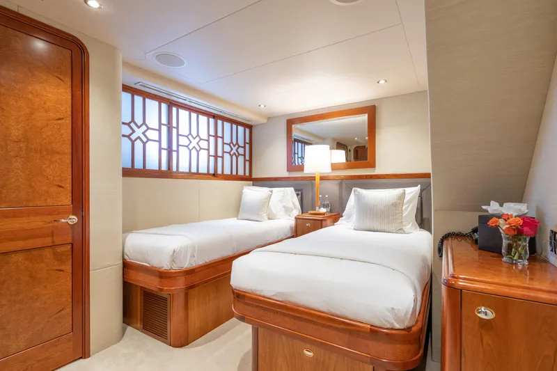 Avalina Yacht Photos Pics Luxurious twin bedroom on 2003 Westport yacht with elegant wood finishes and modern decor.